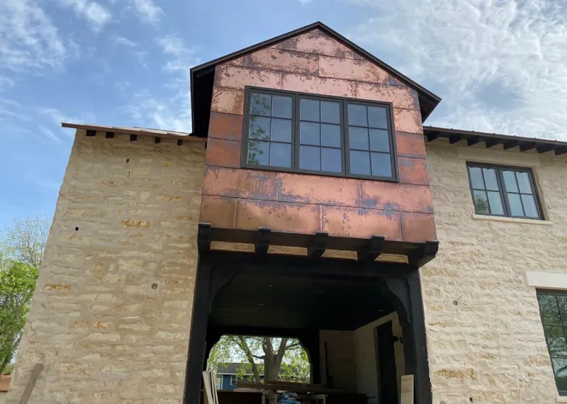 Copper metal panel facade on a stone building for Skylight Installation in Palm Beach Gardens
